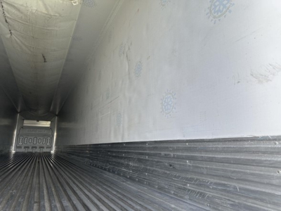 Interior of a Great Dane Carrier 7300 trailer cargo area with ribbed floor and smooth sidewalls.