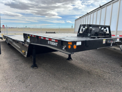 TE80HT Trail-Eze flatbed trailer showing front hitch and black steel frame with a Diamond plate deck and logo TE80HT.