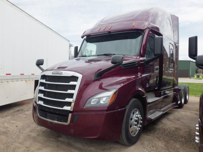 Freightliner Cascadia126 semi-truck cab in maroon with aerodynamic mirrors and chrome grille, side view showing front wheel and sleeper top