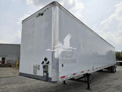 Trailer side view of a 2017 Vanguard VXP box trailer, aluminum exterior, rear with hitch and stabilizer legs, stock number 7780 visible.