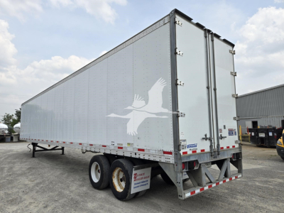 2017 Vanguard VXP trailer side with logo gulls on silver exterior and dual rear doors.