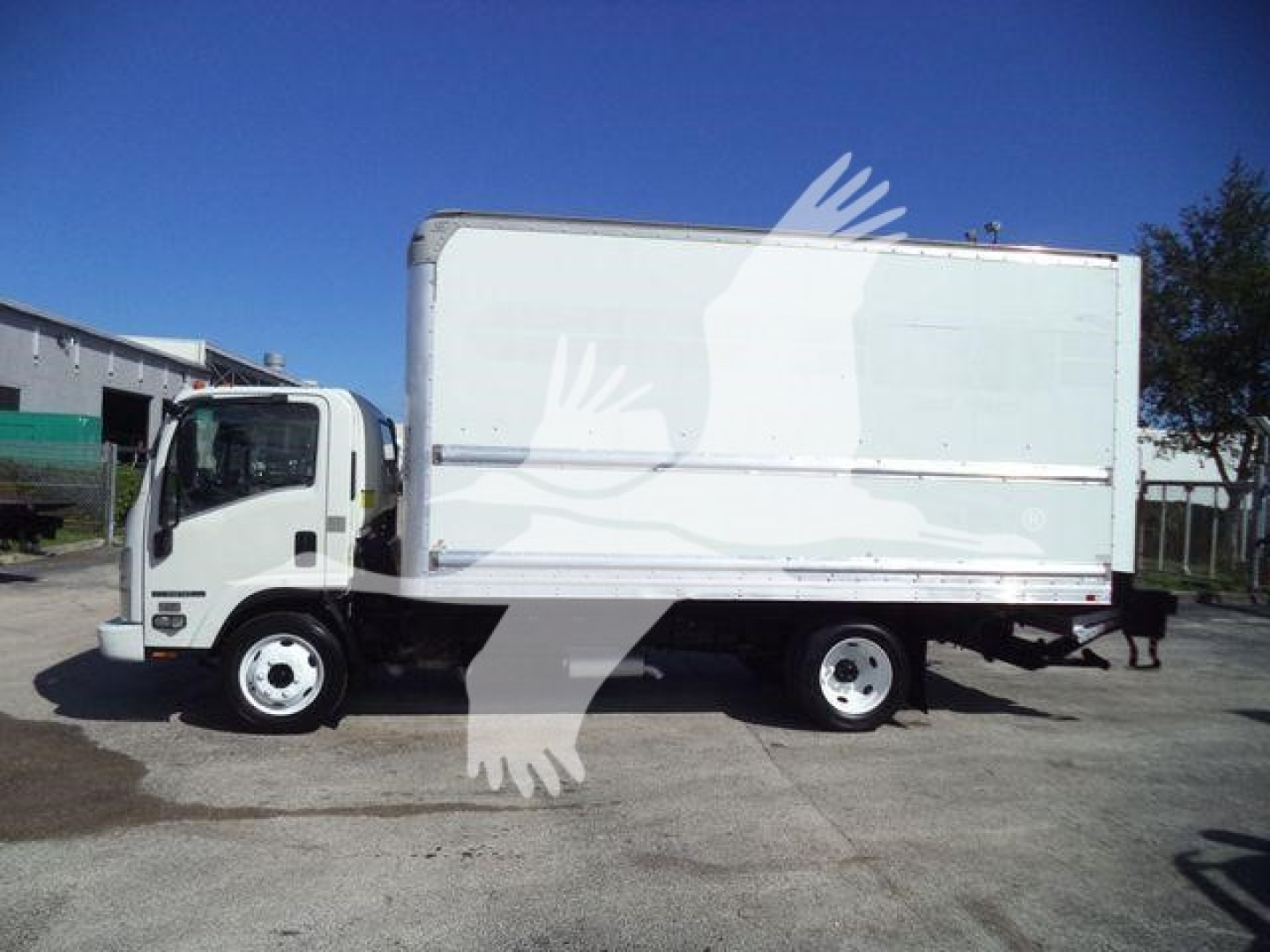 Isuzu NPR-HD box truck side view showing cargo box and cab. Visible text on the listing includes VIN 54DC4W1BXKS801445, Stock T01445, and categories: Box, Trucks, Used.