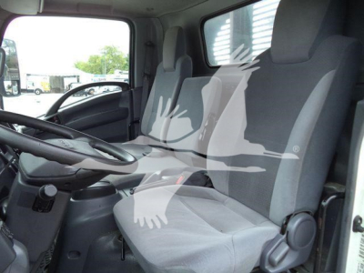 Isuzu NPRR truck interior showing driver seat and passenger seat in cab with steering wheel and dash visible.