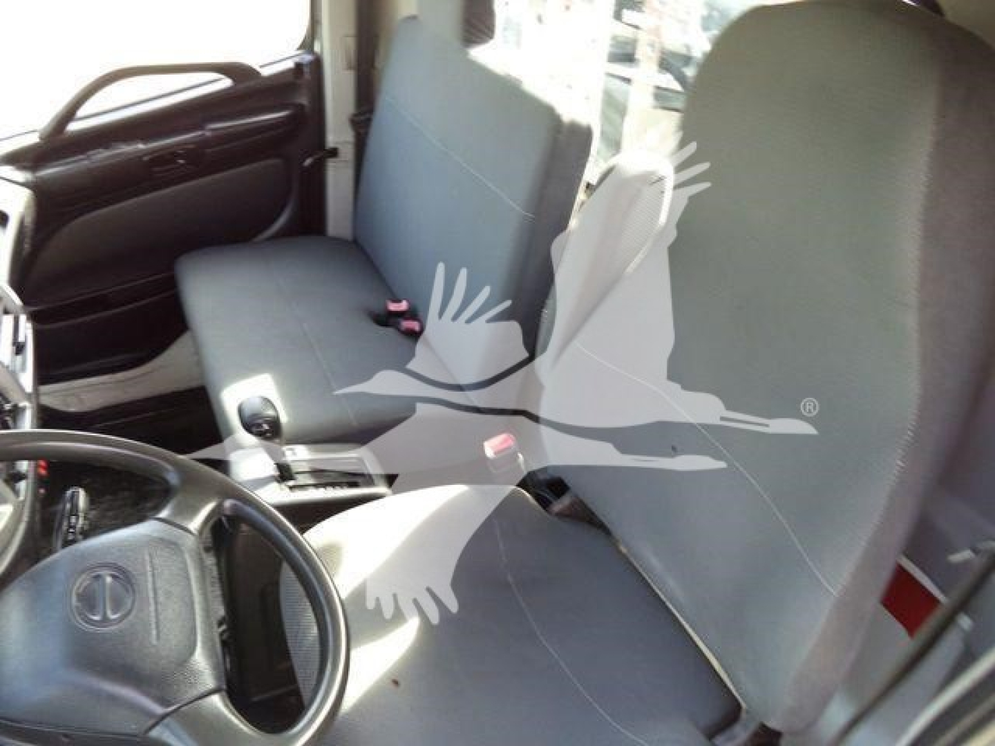 Interior of a 2017 Hino 258LP cab showing driver and passenger seats, steering wheel, and door panel.