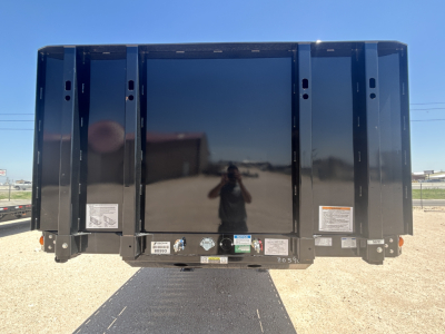  Fontaine HCIFL12SAT trailer rear view with reflective center panel and side skirts, various stickers and labels along bottom edge.