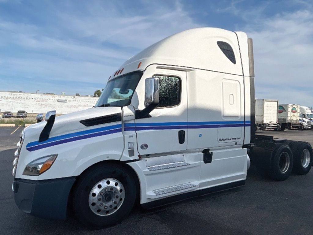 Freightliner Cascadia126 truck in view showing cab and side details with Cummins or Detroit engine badge not visible