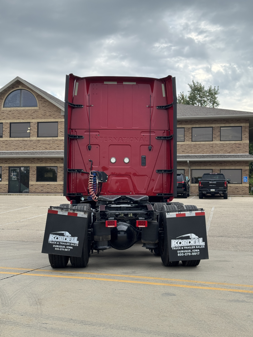 Back view of a red 2018 International LT625 tractor in a parking lot, with black mud flaps reading Kordell Truck Center.