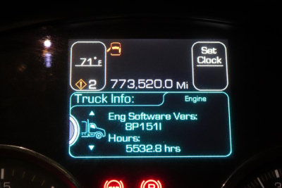 Dashboard display showing vehicle info: Truck Info with Engine software version 8P1511, Hours 5532.8 hrs, Trip mileage 773,520.0 Mi, temperature 71°F, various symbols.