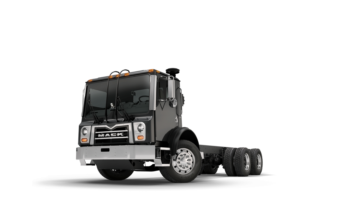 Mack TE64E truck cab and rear chassis visible with front grille and headlights.