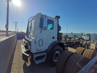 2026 Mack TE64E cab-side view showing front wheel, side mirror, and window; visible on the image are no legible labels or text.