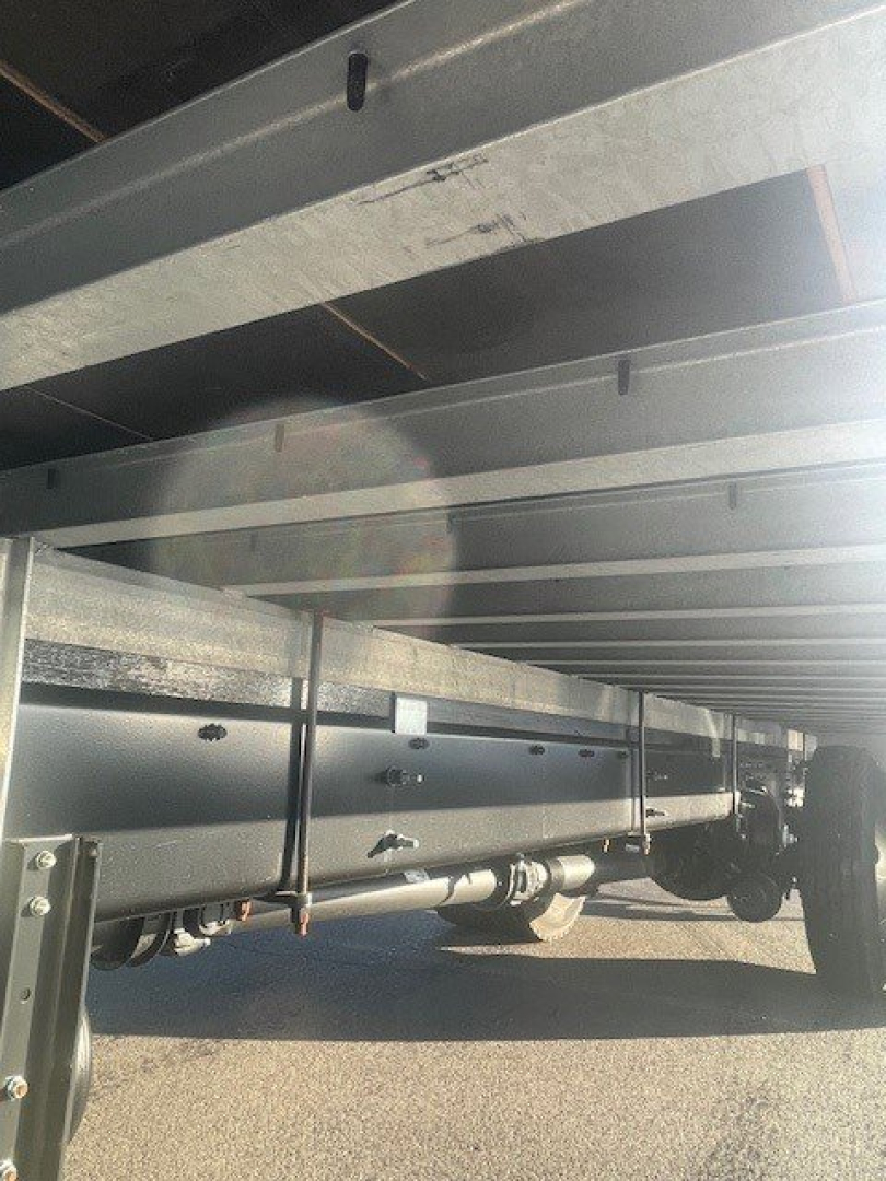Hino L6 box van truck undercarriage view showing frame rails and suspension components.
