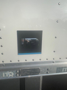 Box van truck side showing ITP logo on access panel and riveted aluminum exterior.