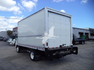 Isuzu NPR-HD box truck rear and passenger side view with large cargo box and white eagle decal on rear door.