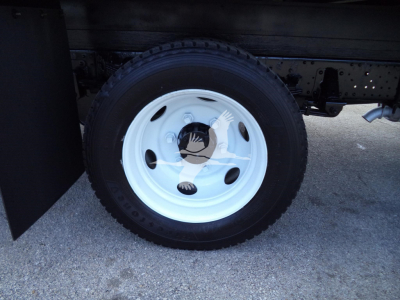 Isuzu NPR HD truck wheel showing white steel rim and tire