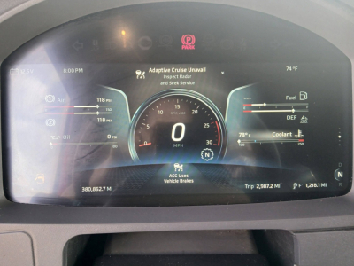 Dashboard display of a 2023 Kenworth T680 showing digital gauges, fuel, DEF, coolant, and trip info. Text includes 118 psi oil, 0 mph, adaptive cruise, 14°F coolant,  bM.