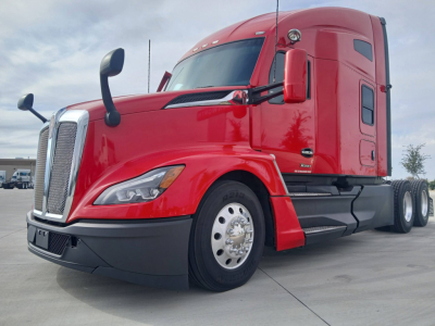 Kenworth T680 truck in red color, front-left view showing cab, chrome grille, large side mirrors, and sleeper cab.
