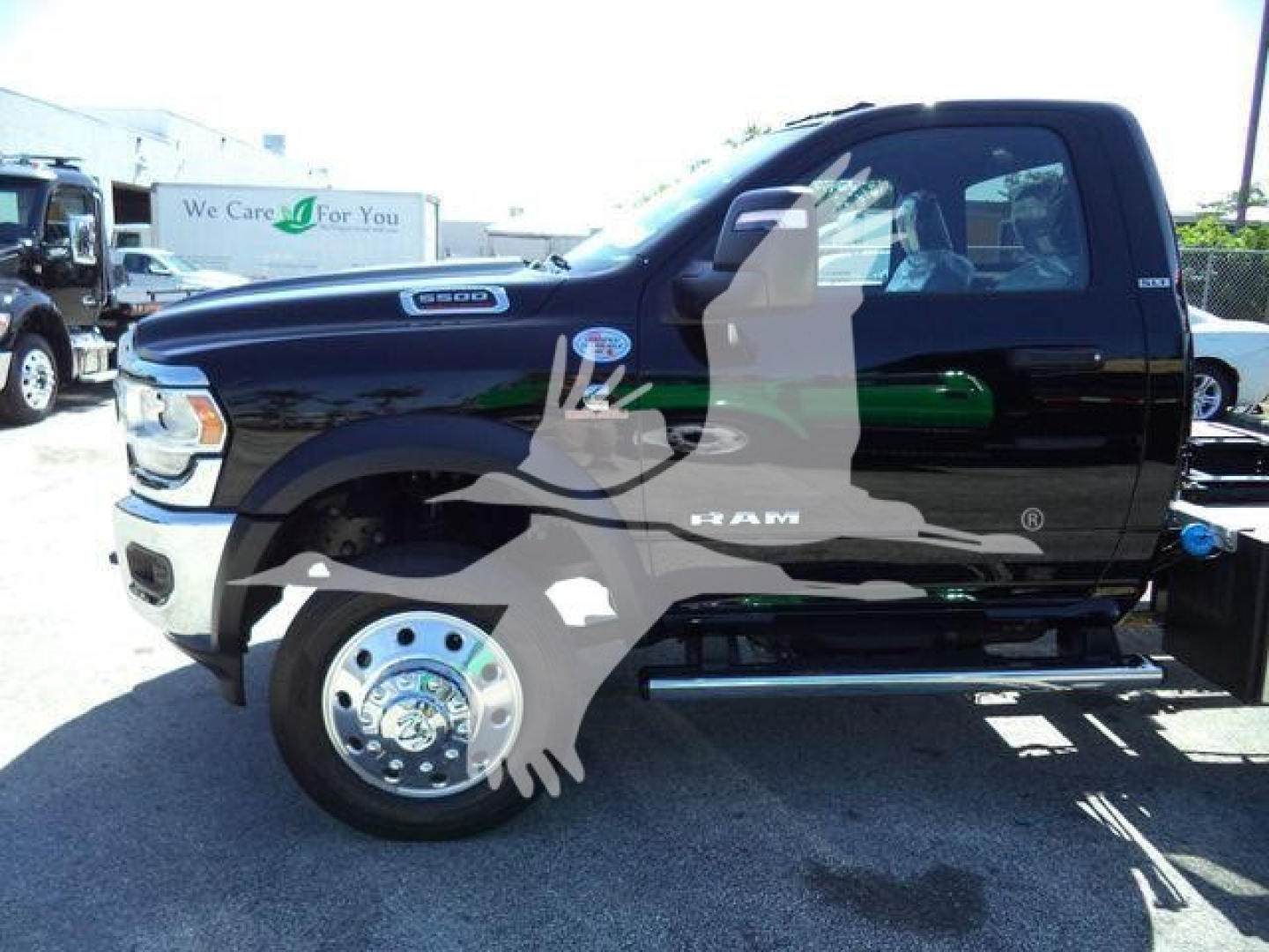 Ram 5500 pickup truck side profile showing SLT badge and wheel details.