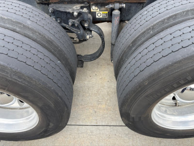 Peterbilt 579 dual rear wheels showing chassis and suspension components between tires.