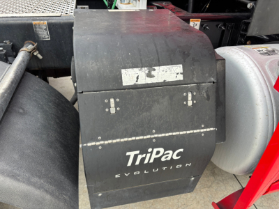 Toolbox mounted on a Peterbilt 579 truck showing TriPac Evolution APU box with labels and hinges.