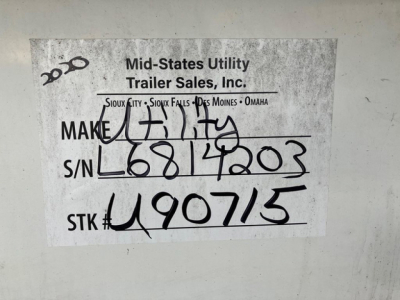 Label on trailer showing handwritten stock, serial, and make info. Reads: MAKE Utah? actually 'MAKE' followed by handwritten 'UTILITY' or 'FULTA'? S/N L6814203? S/N handwritten as L6814203. STK# 490715. Top text shows 'Mid-States Utility Tr