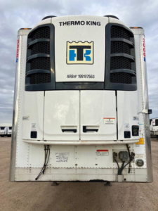 Thermo King refrigeration unit on the front of a refrigerated trailer showing ARB# 199179563 and various control panels.