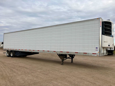 Trailer side view showing a 2020 Utility refrigerated trailer with a Thermo King unit at the front, white corrugated sides, and tandem rear axles.