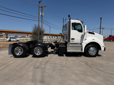 Kenworth T880 conventional cab truck side view showing chassis, sleeper cab, and front wheels.