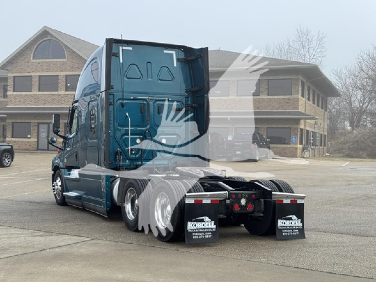 Freightliner Cascadia 126 conventional sleeper tractor rear view showing taillights and mudflaps with stock number 2511155