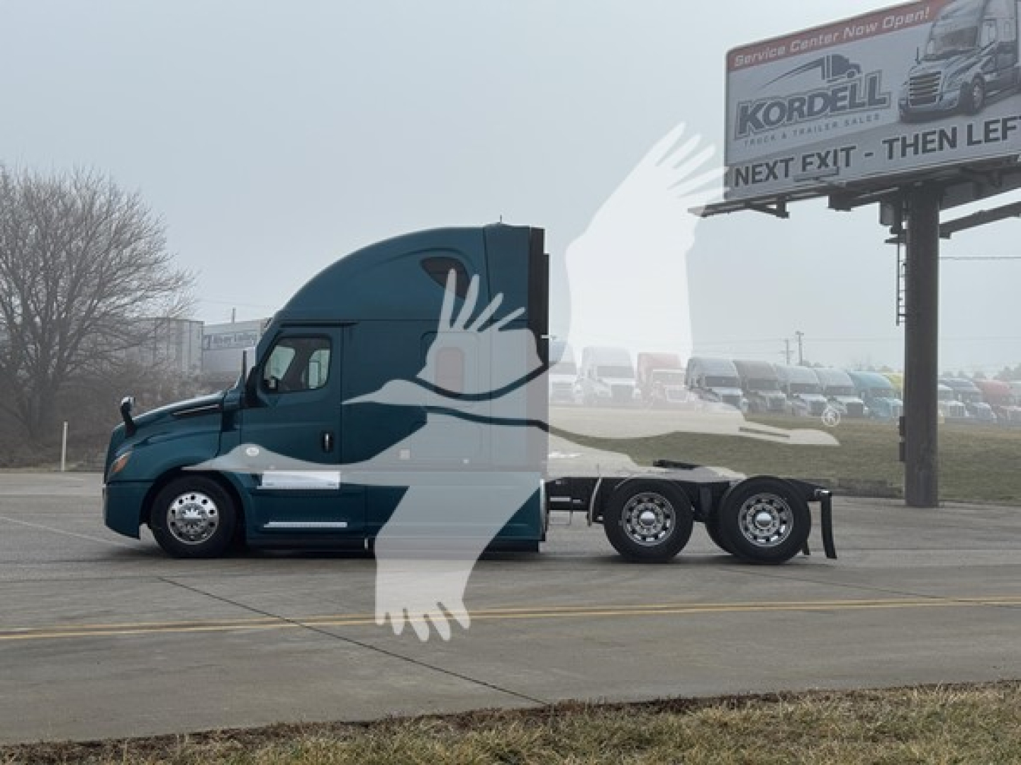 2022 Freightliner Cascadia 126 conventional sleeper truck side view showing blue cab and triple rear axles.
