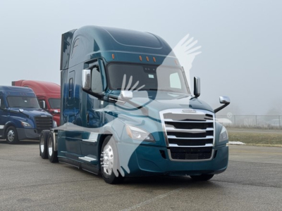 Truck engine bay view of a blue 2022 Freightliner Cascadia 126 conventional sleeper with chrome grille and multiple axles.