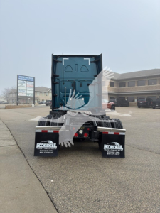Rear view of a Freightliner Cascadia truck tractor with visible rear underrun protection and mud flaps showing 'KORDEAL' branding.
