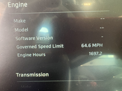 Truck instrument screen showing Engine details: Goverened Speed Limit 64.6 MPH, Engine Hours 1697.2, and fields Make, Model, Software Version, Transmission.