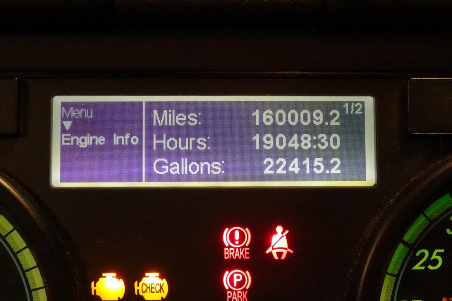 Dashboard readout showing Miles 160009.2, Hours 19048.3, Gallons 22415.2 with warning icons and purple menu on left.