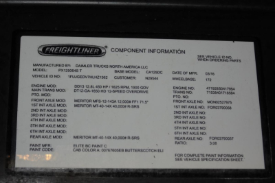 Freightliner badge plate with component information on a Cascadia 125; shows model, VIN fragment, engine and drivetrain data, paint code, and various service notes.