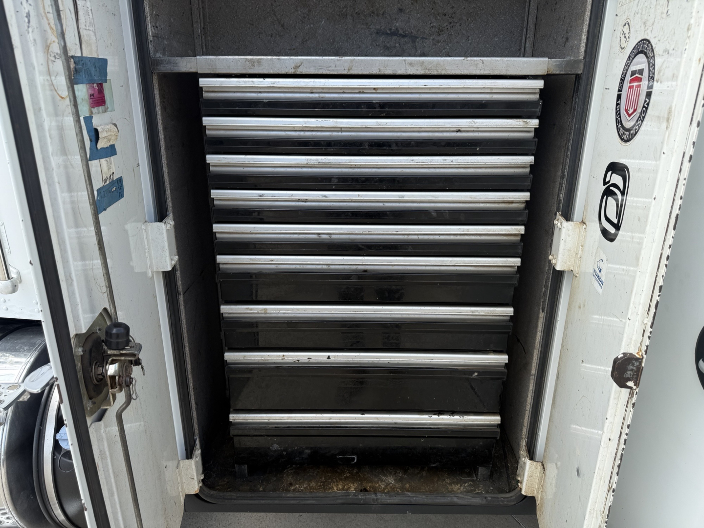 Kenworth T270 service truck storage cabinet with multiple metal drawers visible inside the box.