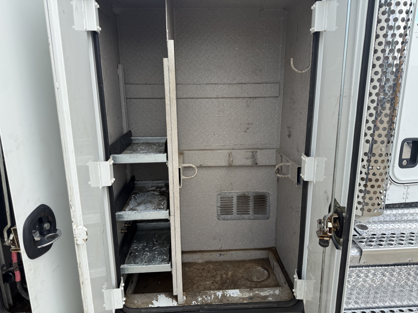 Kenworth T270 service truck cargo area interior with storage shelves and compartments