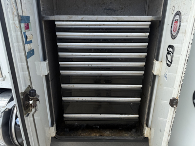Kenworth T270 service truck storage cabinet with multiple metal drawers visible inside the box.