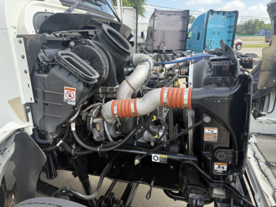 Kenworth T270 engine bay showing air intake, hoses, and radiator area.