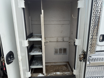 Kenworth T270 service truck cargo area interior with storage shelves and compartments