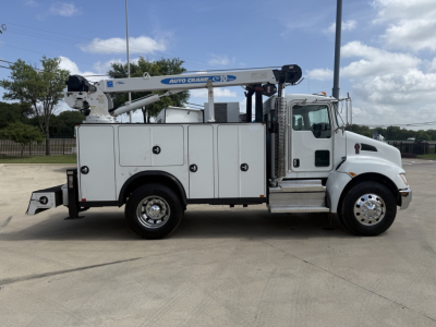 Kenworth T270 service truck with crane arm mounted on bed, side compartments, chrome wheels, white cab and utility body, stock number B3518P.