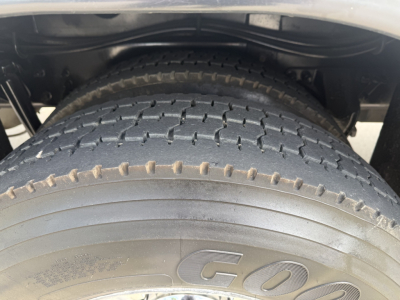 Kenworth T270 wheel and dual rear tires in-view showing tire tread and underbody components.