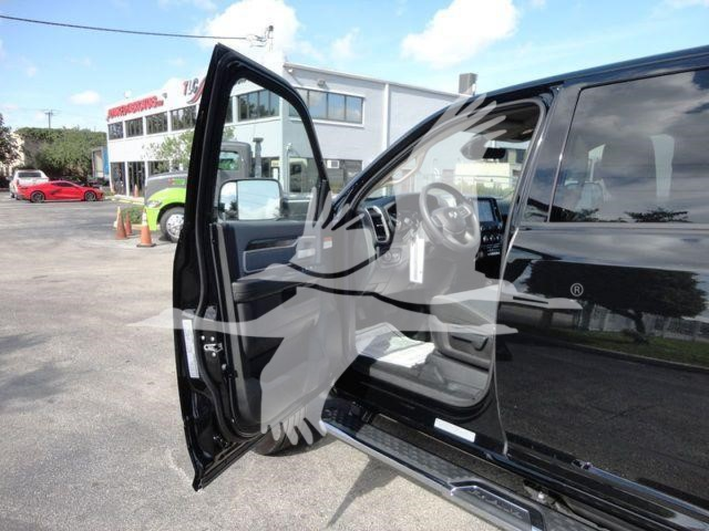 Ram 5500 SLT truck with front passenger door open, showing interior seating and dashboard components.