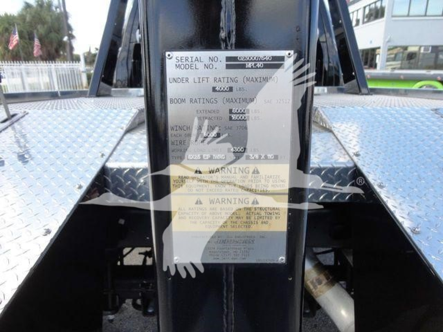 Tag plate on Ram 5500 winch mount showing serial number, model and warning labels.