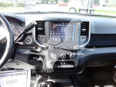 Ram 5500 dashboard and center console view showing touchscreen infotainment, climate controls, steering wheel, and gauge cluster.