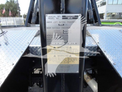 Tag plate on Ram 5500 winch mount showing serial number, model and warning labels.