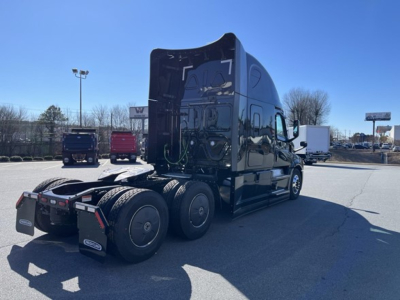 Freightliner Cascadia 126 sleeper tractor tractor rear view showing fifth wheel and dual rear axles.