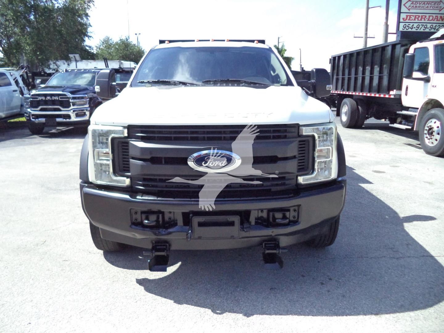 Ford F-450 front view showing grille, headlights, bumper and Ford emblem.