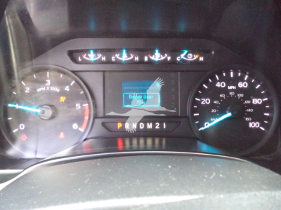 Ford F-450 dashboard view showing speedometer and tachometer with digital display and gear indicator P R N D M 2 1.