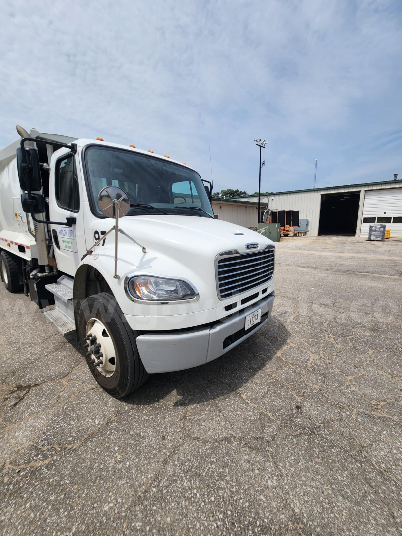 2021 Freightliner M2 106 truck front-left view showing cab and garbage body with stock number 26008-20.
