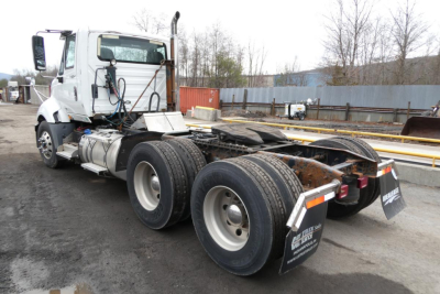 Truck chassis of a 2014 International PROSTAR+ 122 tractor showing rear section and fifth wheel mounting